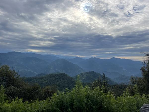 A beautiful view of Nepal's hills with green fields and peaceful villages.-banrupi